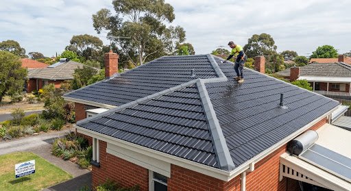 Residential roof restoration showcasing fresh pointing and membrane coating