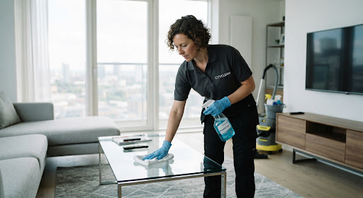 Professional cleaner sanitizing Melbourne home